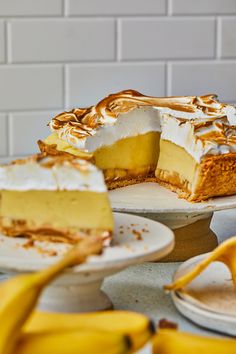 there is a piece of cake on the plate next to another slice of cake and some bananas