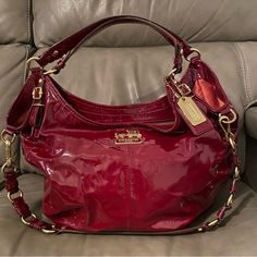 Absolutely Stunning Crimson Red Patent Leather Coach Piece! Madison Sophia Horse And Carriage Line. Beautiful Condition. Clean Interior And Exterior. Can Be Worn As A Hand Bag Satchel Or As A Crossbody Purse. Please See All Photos! Dimensions: 17 Inches Long X 12 Inches Tall. Handle Drop 8 Inches. Long Strap Drop 12 Inches -Please Note Measurements Are Done By Hand And Approximate! Get This Beautiful Bag Now And Pay Later Using Affirm Available At Checkout! Red Satchel, Red Leather Bag, Horse And Carriage, Patent Leather Bag, Red Purses, Leather Coach, Crimson Red, Cute Bags, Crossbody Purse