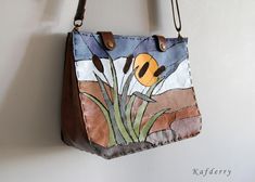 This art to wear bag is made of genuine real leather collage.  Back side is brown leather and there is one big pocket. It is inlined with polyester fabric. There is one pocket with zipper inside. Sizes are 32x 24x 8 cm ( 12.5 x 9.8 x 3 inches). Strap is adjustable. Also I can do the bag as your custom colors. Please don't hesitate to ask me whatever you want. You can ask for a special order for a stained glass model you want customized to leather. Multicolor Leather Satchel As Gift, Artistic Brown Bags For Everyday Use, Multicolor Leather Satchel For Gift, Multicolor Leather Satchel Gift, Artistic Leather Shoulder Bag For Daily Use, Artistic Brown Shoulder Bag For Daily Use, Artistic Brown Bag For Everyday Use, Artistic Leather Travel Bag, Artistic Brown Bag For Daily Use