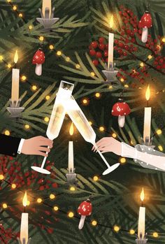 two people are toasting with champagne in front of a christmas tree filled with candles