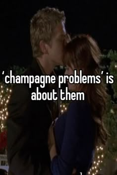 a man kissing a woman with the caption champagne problems is about them