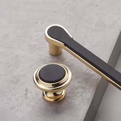 a black and gold handle on a door