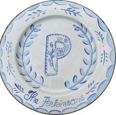 a blue and white plate with the letter p on it