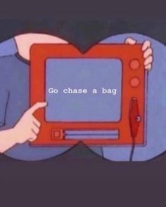 a person holding an orange and black television with the words go chase a bag on it