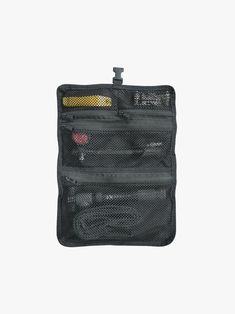 an empty black pouch with two compartments