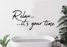 a bathtub with the words relax it's your time written in black ink