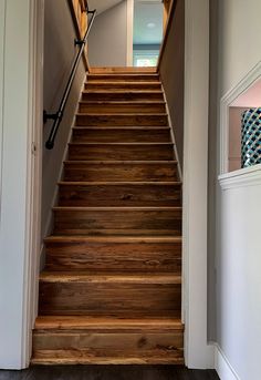 a wooden staircase leading up to the second floor