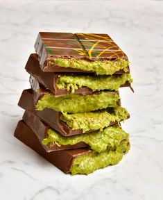 four pieces of chocolate with guacamole on top