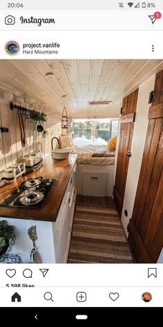 a kitchen area with sink, stove and cabinets in a small space that is well lit