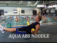 the man is doing exercises in the swimming pool