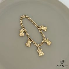 Description  Teddy bear bracelet in 333/8 carat yellow gold The gold bracelet for children or adults is a real eye-catcher and enhances every look in a great way. Especially the 5th little bear elements set cute accents. The bracelet is made of 333 gold and is adjustable in length. Material: 8K / 333 yellow gold Bracelet length: 19 cm (adjustable) Width of the chain of the bracelet: 5 mm Dimensions of the bear elements: H: 17 mm W: 11 mm Article number:01060 Gold and silver jewelry is our passio Hypoallergenic Yellow Gold Plated Charm Bracelet, Teddy Bear Jewelry, Hello Kitty Birthday Theme, Luxury Wishlist, Gold Teddy Bear, Bear Bracelet, Gold And Silver Jewelry, Bracelets Design, Gold Armband