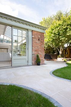 a house with a patio and large glass doors