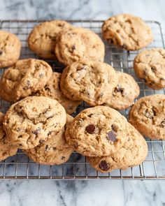 chocolate chip cookies on a cooling rack ready to be eaten by someone who is about to eat them