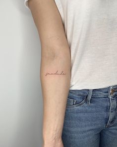 a woman with a small tattoo on her arm