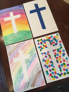 four different colored paper pictures with the words jesus and cross painted on them, all in rainbow colors