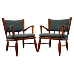 a pair of chairs with armrests and arms in the style of hans krissel