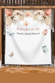 a white banner with pink flowers and butterflies on it that says, butterflies for live sarah's bridal shower