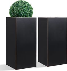 two black square planters sitting next to each other