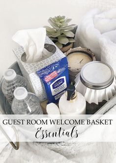 a basket filled with personal care items on top of a white blanket and the words guest room welcome basket essentials