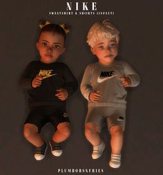 two small children are wearing nike clothing and sitting next to each other on a black background