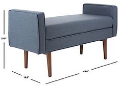 a blue bench sitting on top of a wooden floor next to a white wall with measurements