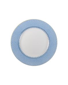 a blue and white plate on a white background