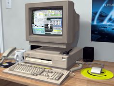 an old computer sitting on top of a wooden desk