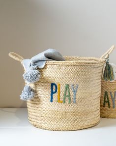 two baskets with the word play written on them