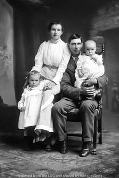 an old black and white photo of a family