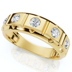 a yellow gold ring with three diamonds on the side and four smaller round stones in the middle