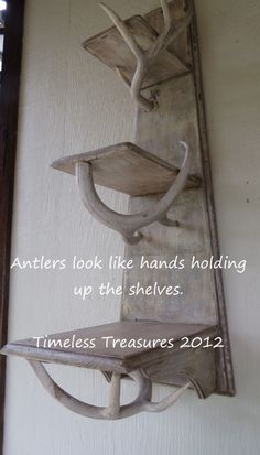 a wooden shelf with two shelves on it and a quote above it that reads, antlers look like hands holding up the shelves