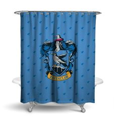 a blue shower curtain with the hogwarts crest on it