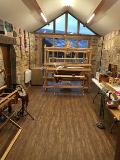 a room filled with lots of wooden furniture and decor on top of hard wood flooring