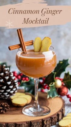 cinnamon ginger cocktail in a coupe glass with an apple slice and cinnamon stick garnish