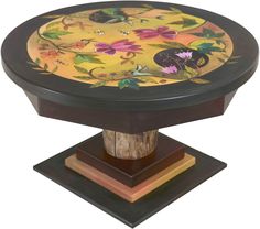 an artistically painted wooden pedestal with flowers on it