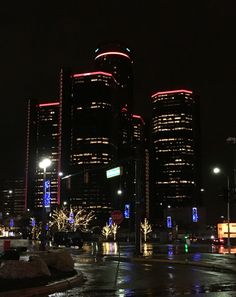 the city is lit up at night with christmas lights