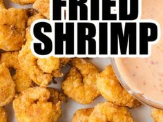 fried shrimp on a plate with dipping sauce in the middle and text overlay that reads fried shrimp