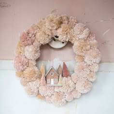 a teddy bear wreath with houses on it