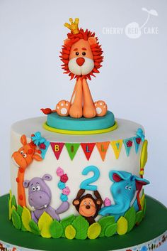 a birthday cake with a lion on top