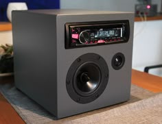 a radio sitting on top of a wooden table