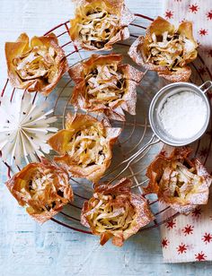 small pastries on a wire rack with powdered sugar