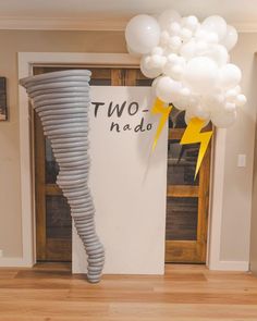 there is a large balloon in the shape of a tornado