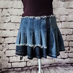 A Casual Slay, No Biggie. The Akira Label Asymmetrical Denim Mini Skirt Features A Slightly Stretchy Sandblasted Frayed Denim Fabrication, A Pleated Design, An Asymmetrical High Low Mini Length Silhouette, And An Hidden Side Zipper Closure. Complete With Raw Hem Detailing And Two-Tone Denim.. Style This Piece With A Cropped Button Down Blouse And Low Key Loafers For A Luxe Twist On The Pleated Mini Trend. - 75% Cotton 23% Polyester 2% Spandex - Some Stretch - Distressed Casual Look - Nwt All Mea Fitted Punk Denim Skirt, Edgy Fitted Dark Wash Mini Skirt, Edgy Fitted Dark Wash Denim Skirt, Edgy Fitted Dark Wash Skirt, Fitted Denim Grunge Skirt, Fitted Denim Skirt In Grunge Style, Edgy Fitted Cutoff Denim Skirt, Edgy Fitted Cutoff Mini Skirt, Fitted Asymmetrical Denim Skirt In Dark Wash