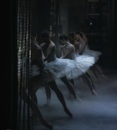 ballet dancers in white tutus and black stockings