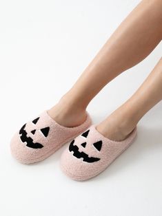 Slip into spooky season style with Shiraleah’s Jack O’Lantern Slippers. These adorable light pink slippers feature an embroidered smiling jack-o-lantern face design on both feet, allowing you to bring the Halloween spirit with you all season long. Made from fuzzy and durable materials, you’ll never want to take them off! Pair with other items from Shiraleah’s Spooky Season collection to complete your look! Shiraleah is a trend-driven lifestyle brand focused on the little gifts that make life spe Fun Pink Indoor Slippers, Lantern Designs, Football Earrings, Jack O Lantern Faces, Pink Slippers, Open Toe Slippers, Comfortable Slippers, Accessories Display, Graphic Tee Dress