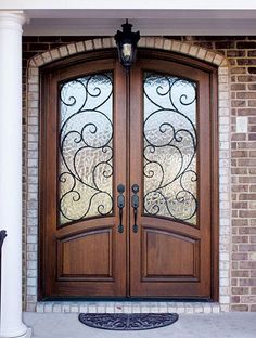 the front door to a house with two glass doors