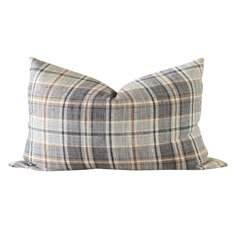 a plaid pillow on a white background