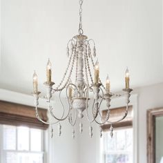 Lend striking visual appeal to your dining room or foyer with this chandelier. A durable wood frame ensures lasting quality, six lights surround the frame to emit glistening light throughout your space. Parrot Uncle 6-Light Distressed White French Country/Cottage WoodChandelier | BB8817-6110V Farmhouse Chandelier Bedroom French Country, Modern French Country Chandeliers, French Country Chandelier Dining Room, French Farmhouse Lighting, French Country Light Fixtures, Farmhouse Chandelier Dining Rooms, French Country Chandelier, Swag Chandelier, Country Chandelier