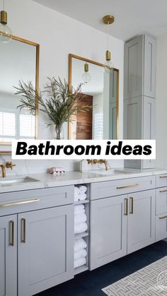 a bathroom with two sinks, mirrors and towels on the counter top next to each other