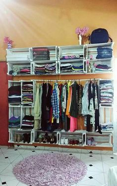 an organized closet with clothes and shoes